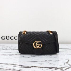 Gucci GG Marmont shoulder bag with gold hardware and black Matelassé leather